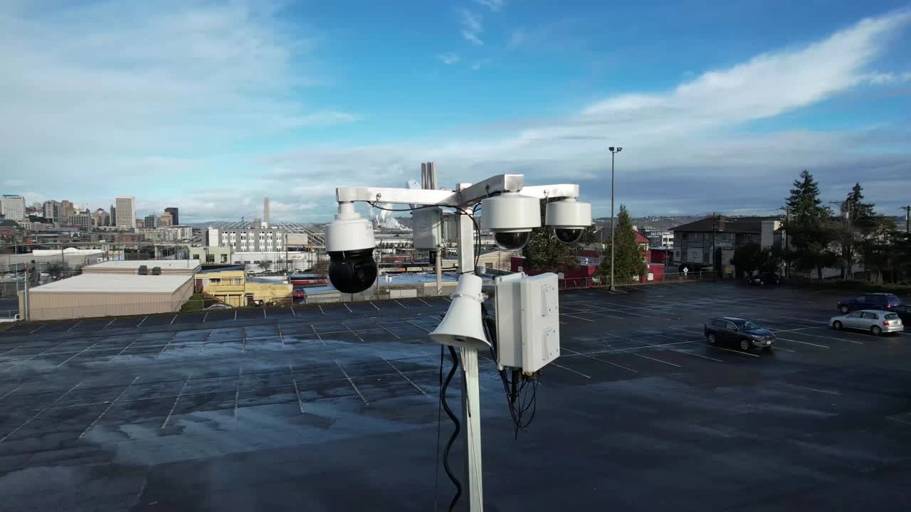 High-definition PTZ surveillance cameras mounted on mobile security trailer mast
