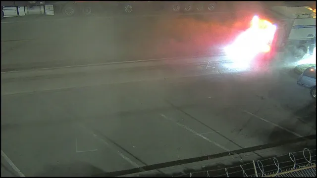 Vigil S5 Critical alert — large truck engulfed in flames in a parking lot at night, May 2026